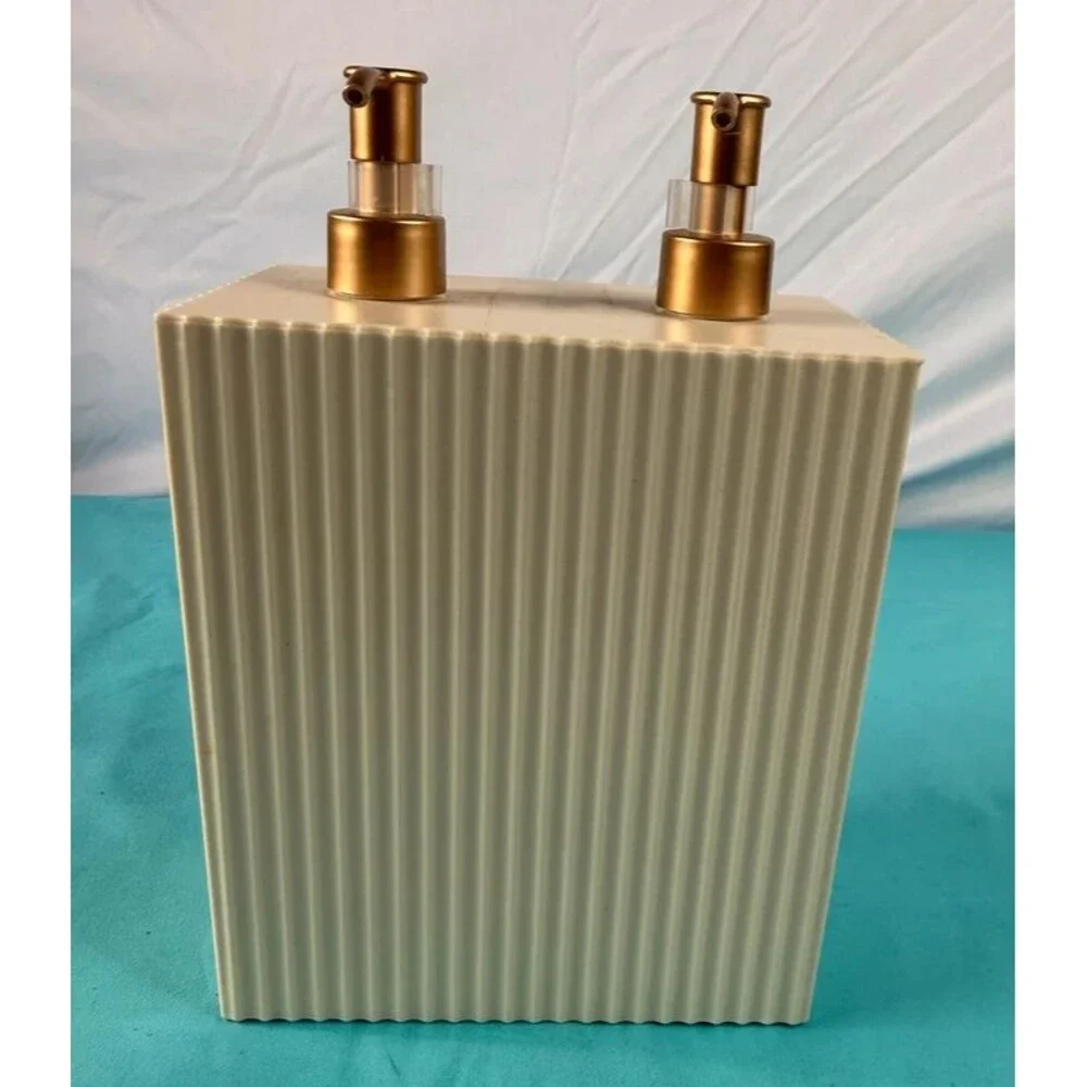 Cream colored ribbed dual-pump soap and lotion dispenser